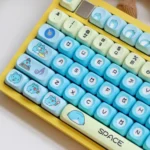 Vibrant Bugcat Capoo PBT dye-sub keycaps set shown from various angles. Adorable characters and durable, whimsical pastel blue and pink designs.