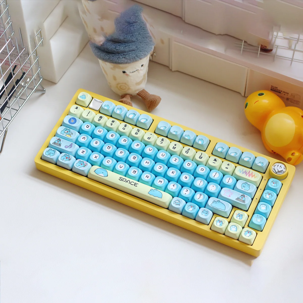 Adorable Bugcat Capoo PBT dye-sub keycaps set in vibrant blue and pastel, showcasing whimsical characters for a playful keyboard.