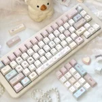 Whimsical pastel bunny keycaps set from the Dessert Party Set, showcasing adorable bunnies enjoying sweets across various angles of the mechanical keyboard.