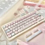 A delightful collection of whimsical pastel bunny keycaps set from the Dessert Party Set, shown from various angles, highlighting their charming mechanical keyboard.