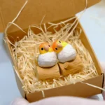 Gallery of the exquisitely handcrafted vibrant Caique parrot artisan keycap, showcasing its lifelike details and artistic charm from multiple angles.