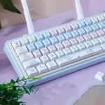 This gallery image showcases the adorable Cat Cake PBT dye-sub keycap set from multiple angles, highlighting its whimsical pastel cat and cake motifs.