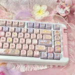 Iconic Cardcaptor Sakura PBT dye-sub keycap set, featuring whimsical pastel pink and purple anime motifs from various enchanting angles.