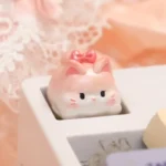 Gallery view of a charming, pastel-toned handcrafted adorable sweet cat artisan keycap, highlighting intricate details from multiple playful angles.