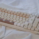 A delightful collection of PBT Cat Eat Japanese Food keycaps set showcasing playful cats enjoying ramen, sushi, and other vibrant Japanese dishes from various angles.