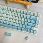 Tranquil Chinese Landscape Cherry Keycap Set, a collection showcasing glowing ink wash art of serene mountains and rivers from various angles.