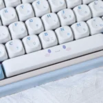 Cinnamoroll PBT keycaps set gallery showcasing whimsical designs in soft hues from multiple angles. These durable, smooth keycaps bring whimsical design.