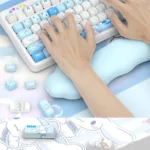 Detailed views of a whimsical Cinnamoroll PBT dye-sub keycap set, showcasing its crisp character art and soft blue and white pastel design.