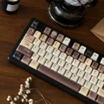 Coffee PBT Keycaps set from a side angle, revealing the sculpted Cherry profile and rich dye-sublimated vintage coffee aesthetic.