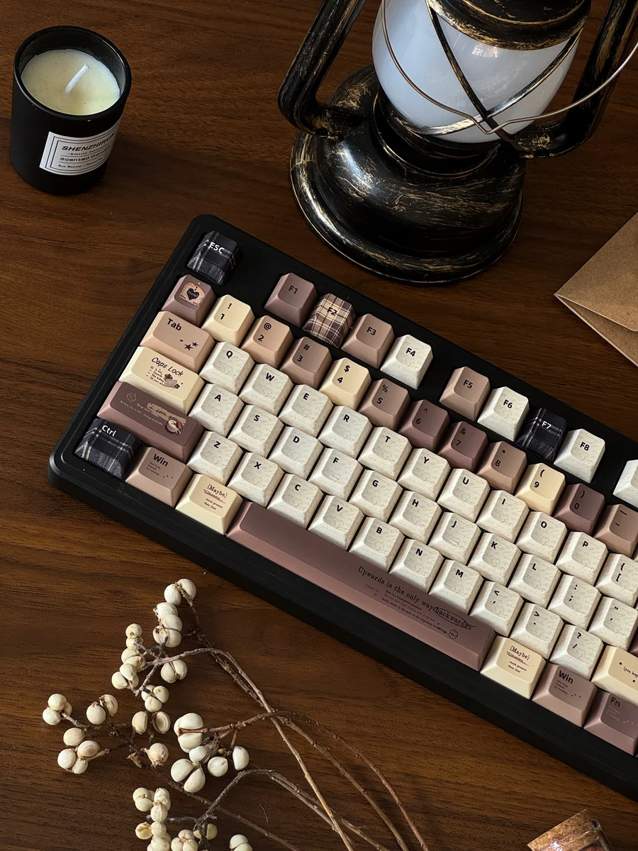 Coffee PBT Keycaps set from a side angle, revealing the sculpted Cherry profile and rich dye-sublimated vintage coffee aesthetic.