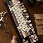 Artistic Coffee PBT Keycaps set featuring a unique vintage Cherry aesthetic with durable dye-sub PBT in warm coffee and cream hues.