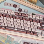 Coffee Whisper PBT keycap set, showcasing durable dye-sub PBT with warm coffee and rose tones from multiple angles.