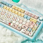 A playful angle shot of the Crayon Shin-chan PBT MOA keycap set, featuring vibrant character art and smooth spherical profiles.