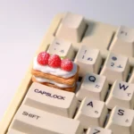 Multiple views of the handcrafted Cream Raspberry Layer TAB artisan keycap. Intricate layered dessert details, sweet cream, and vibrant raspberry.
