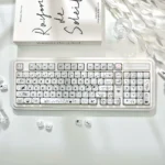 Translucent Crystal Jelly MAO keycaps set featuring playful pastel cat designs, displaying their sleek ergonomic profile and double-layered depth from various angles.