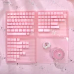 Playful pink translucent Crystal Jelly MAO keycaps set featuring charming side-engraved cat art, highlighting their ergonomic profile and whimsical depth.
