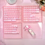 Pink translucent Crystal Jelly MAO keycaps set with playful cat art, featuring a sleek MAO profile for an ergonomic, artistic keyboard.