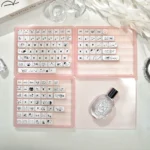 Playful white translucent Crystal Jelly MAO keycaps set featuring elegant cat line art, showcasing the sleek ergonomic profile and double-layered depth.