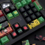 Exclusive Damian Wayne Robin artisan keycap set gallery showcasing intricate superhero details and vibrant comic book aesthetic from multiple dynamic angles.