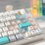 Designer PBT & Frosted PC Keycap Set, showing premium modern aesthetic, hybrid PBT and frosted translucent PC construction, and crisp legends.