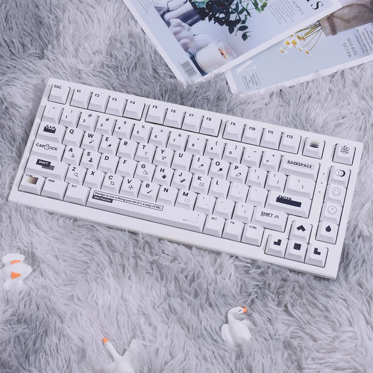 A premium 130-key black and white Designer PBT dye-sub keycap set, showcasing crisp legends and a modern two-tone design for brilliant backlight enhancement design.