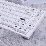 Close-up shots of the Designer PBT keycaps set, showcasing their modern two-tone design, crisp dye-sub legends, and brilliant backlight compatibility.