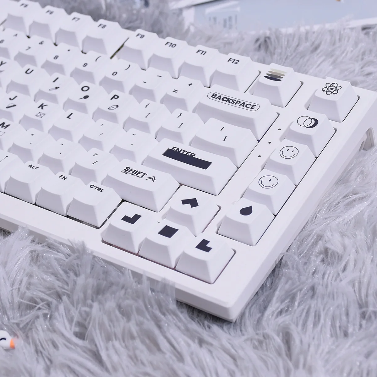 Close-up shots of the Designer PBT keycaps set, showcasing their modern two-tone design, crisp dye-sub legends, and brilliant backlight compatibility.