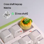 Whimsical handcrafted matcha dessert artisan keycap, a charming green miniature for mechanical keyboards.