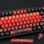 Premium artisan Diluc keycap set showcasing fiery dark red, black, and gold Genshin Impact Diluc character motifs, an exclusive collectible.