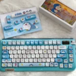Iconic Doraemon PBT dye-sub keycaps set, vividly displaying beloved characters and gadgets for a playful, high-quality keyboard aesthetic.