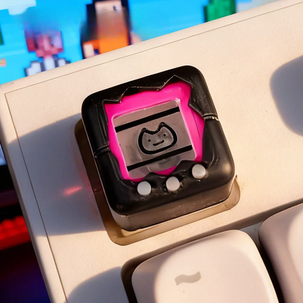 Nostalgic Electronic Pet Keycap product gallery, showcasing the detailed retro console design and playful miniature replica from various angles.