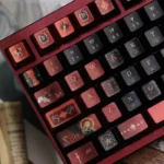 Detailed angled view of the handcrafted Fallen Starlight Lucifer artisan keycap set, revealing its dark celestial design and impressive metallic luster.