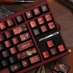 Handcrafted Fallen Starlight Lucifer artisan keycap set from a different angle, showcasing its dark celestial metallic luster and dramatic fallen angelic design.