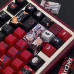 A close-up top view of the premium Fate/Stay Night Red Archer keycap set, showcasing its exclusive heroic design with intricate red and black anime character design.