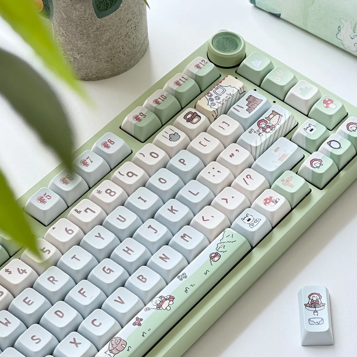 Side view of Spring Forest Whimsy PBT keycaps set, highlighting their enchanting forest design and durable PBT. Lush whimsical flora creates a serene, artistic.