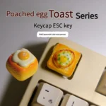Close-up views of a whimsical handcrafted 3D fried egg toast artisan keycap, showcasing its vibrant yellow yolk and intricate details from multiple angles.