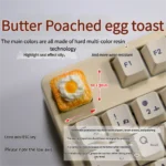 Playful artisan keycap featuring a handcrafted 3D creamy fried egg on golden toast, a whimsical miniature design.
