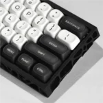 Angled shot of the PBT Galaxy Keycaps set, emphasizing the ergonomic MOA profile and intricate monochrome celestial patterns for an immersive cosmic aesthetics.