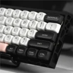 Artistic gallery of Galaxy Keycaps Set, showcasing intricate monochrome cosmic patterns and ergonomic MOA profile from diverse angles.