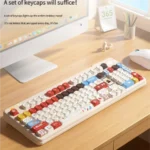 A vibrant gallery showcasing the Super Player retro gaming keycap set from various angles, featuring its playful primary colors and bold pixel art aesthetics art.