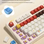 A playful collection of Super Player retro gaming keycaps set, featuring bold primary colors and pixel art, shown from multiple perspectives.