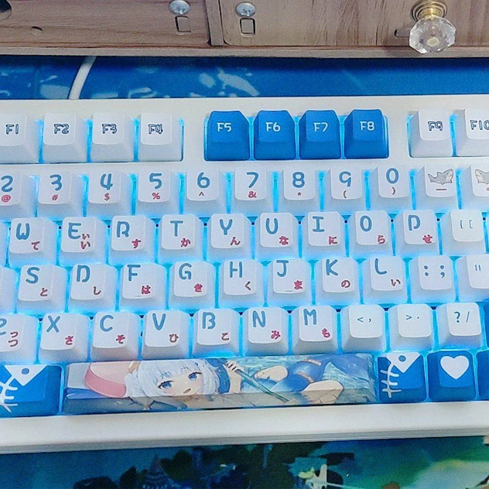 Vibrant Gawr Gura PBT keycaps set featuring cute shark-themed designs in oceanic blues, highlighting premium dye-sublimation details across the full set.