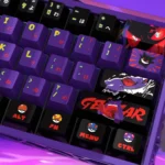 A collection of Gengar pearlescent PBT keycaps set for magnetic switches, showcasing their shimmering, high-gloss metallic finish from multiple angles.