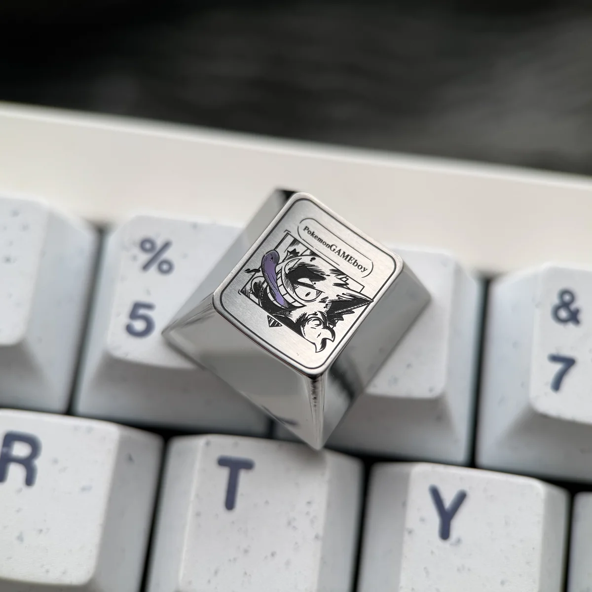 Artisan crafted Gengar Titanium Pokemon Keycap ESC from different angles, highlighting its vibrant anodized finish and premium titanium alloy.