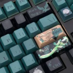 Premium Genshin Alhaitham keycaps set, showcasing intricate green and gold Dendro scholar accents from multiple angles.