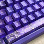 A close-up, high-angle view of the exclusive Genshin Cyno metallic coating keycap set, highlighting its handcrafted intricate details and striking premium finish.