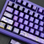 Exclusive handcrafted Genshin Cyno metallic coating keycap set. Multiple angles reveal intricate details, a striking metallic finish, and Cyno's iconic aesthetic.