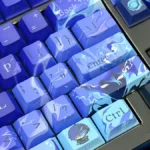Close-up of an exclusive Genshin Impact Flins side-legend keycap set, showcasing its vibrant anime art and unique design from multiple angles on a keyboard.