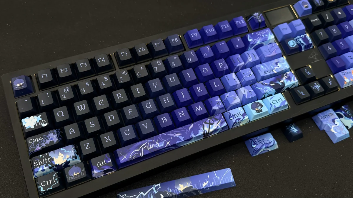 Exclusive Genshin Impact Flins side-legend keycap set for mechanical keyboards, showcasing vibrant anime character art and a minimalist design.