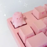 Close-up views of the whimsical ghost cat keycap, showcasing its hand-painted resin details, translucent pastel gradients, and unique ethereal design.